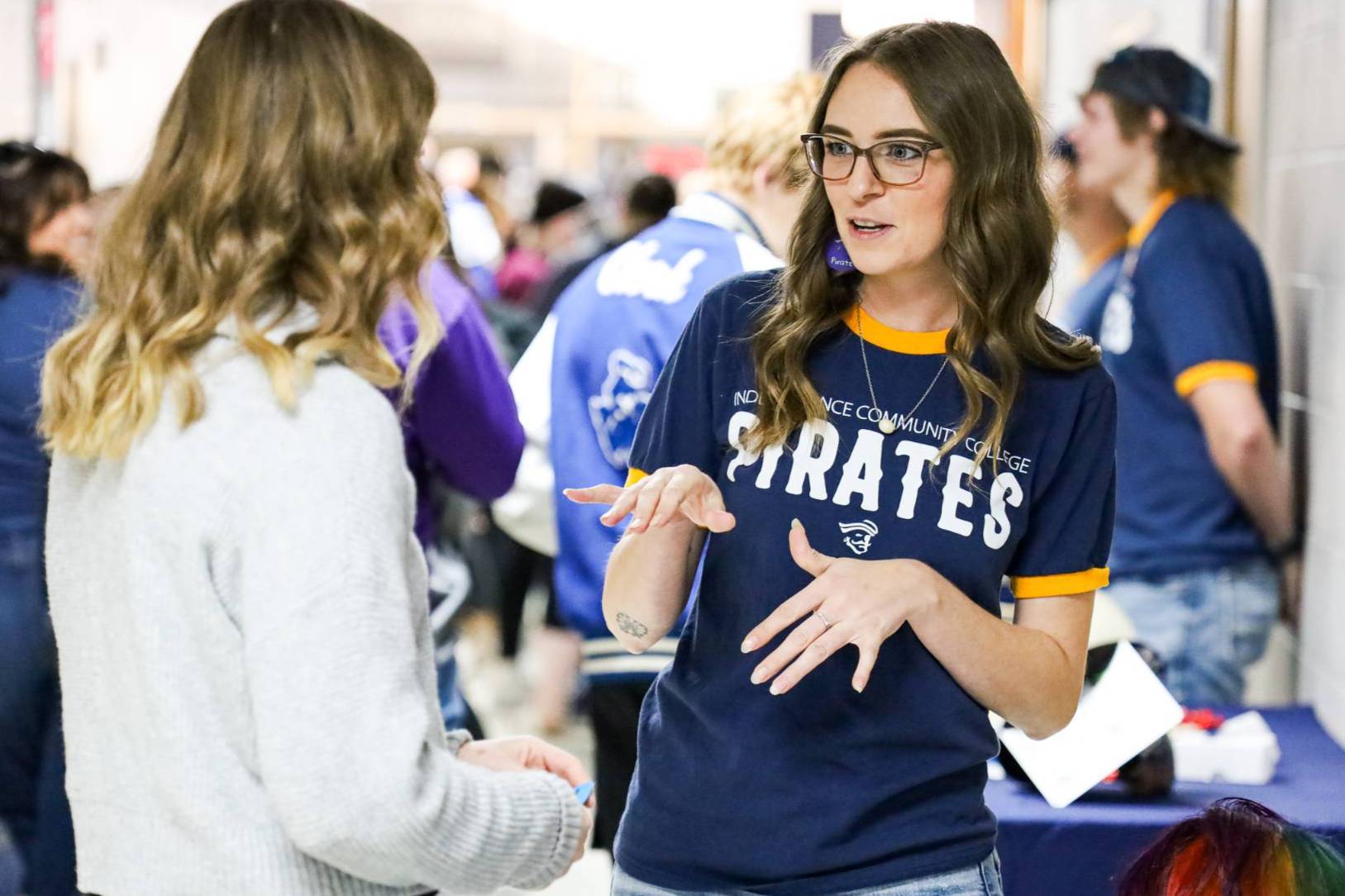 staff member talking to student