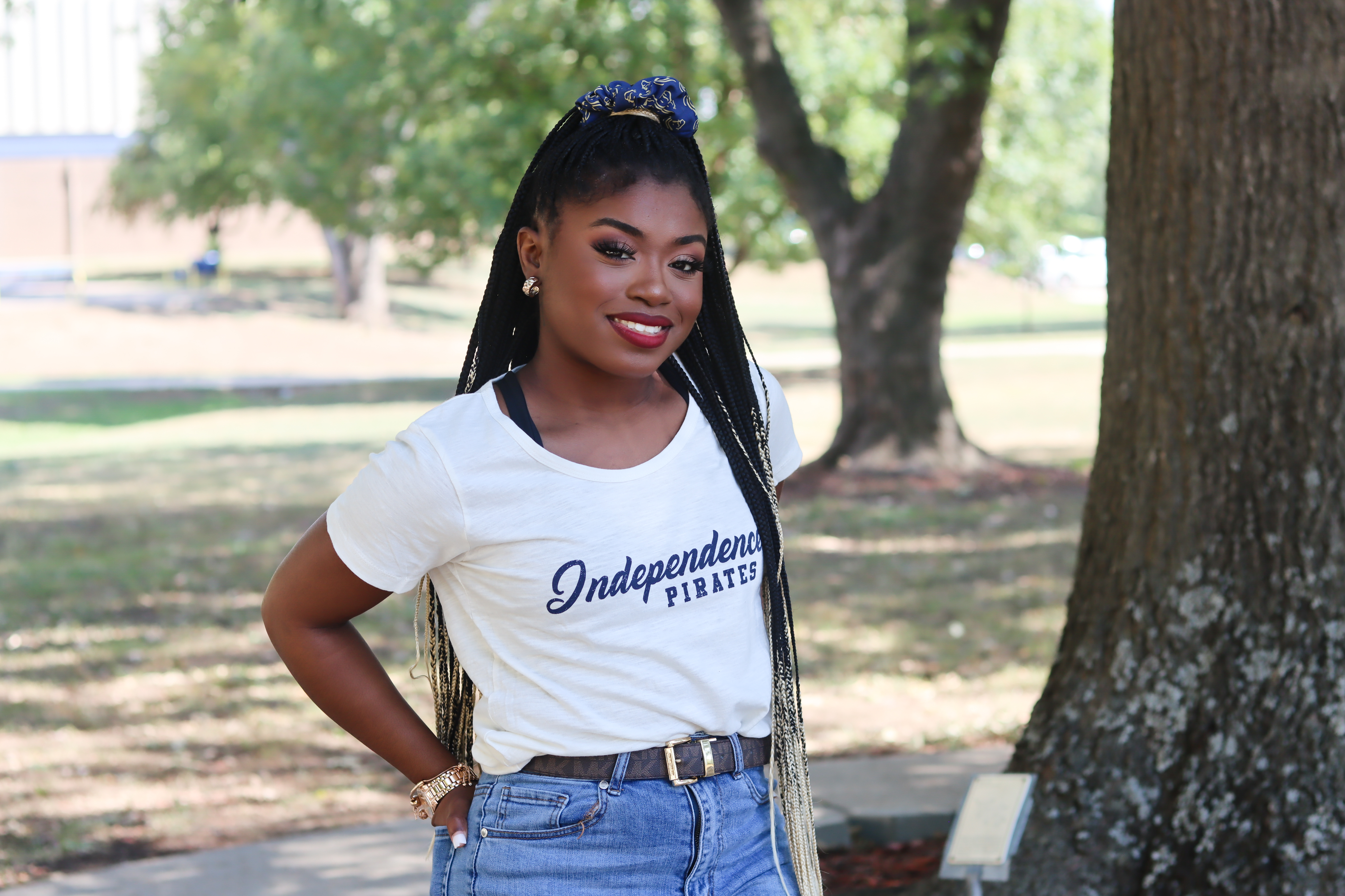student smiling outside
