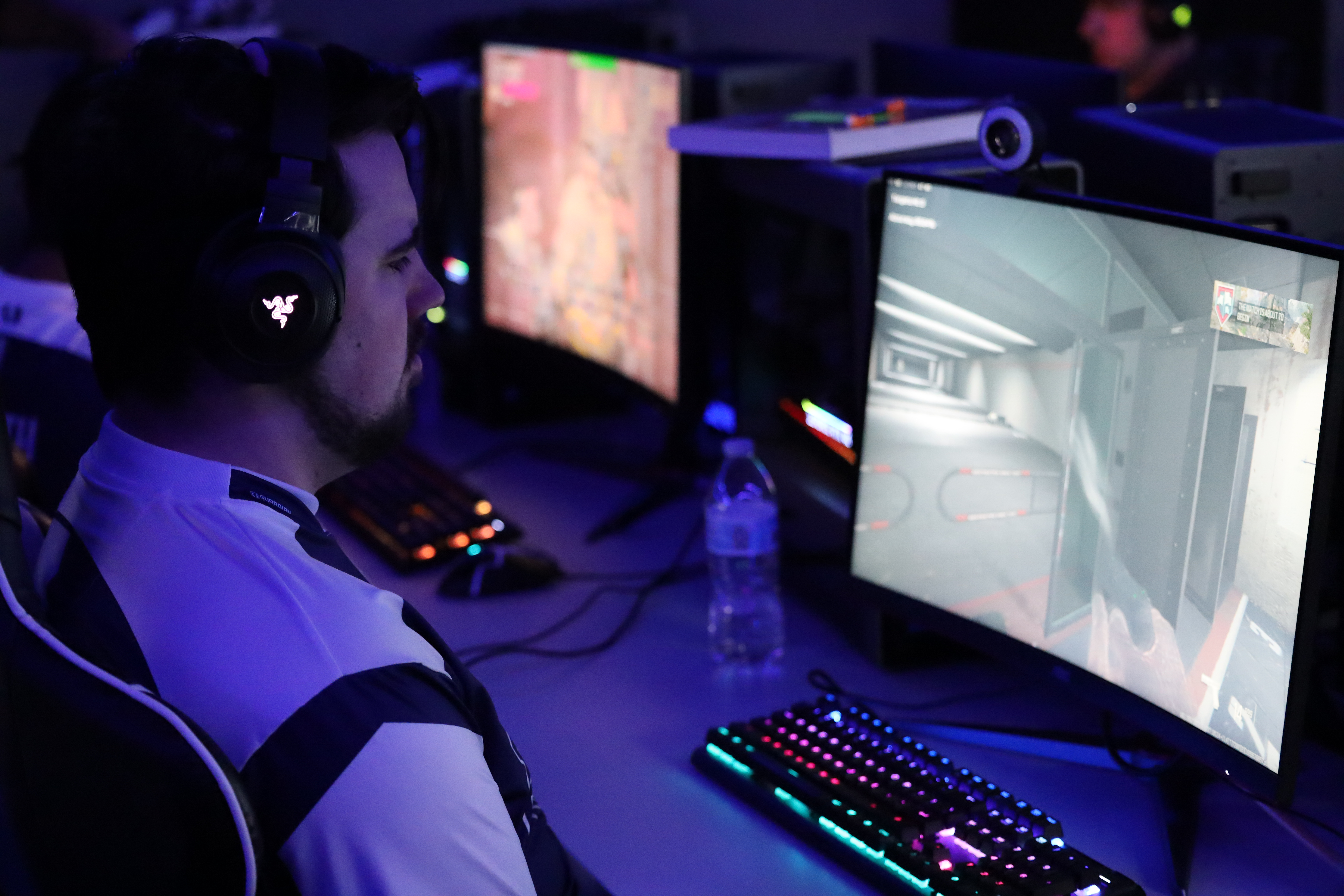 esports gamer playing game on pc