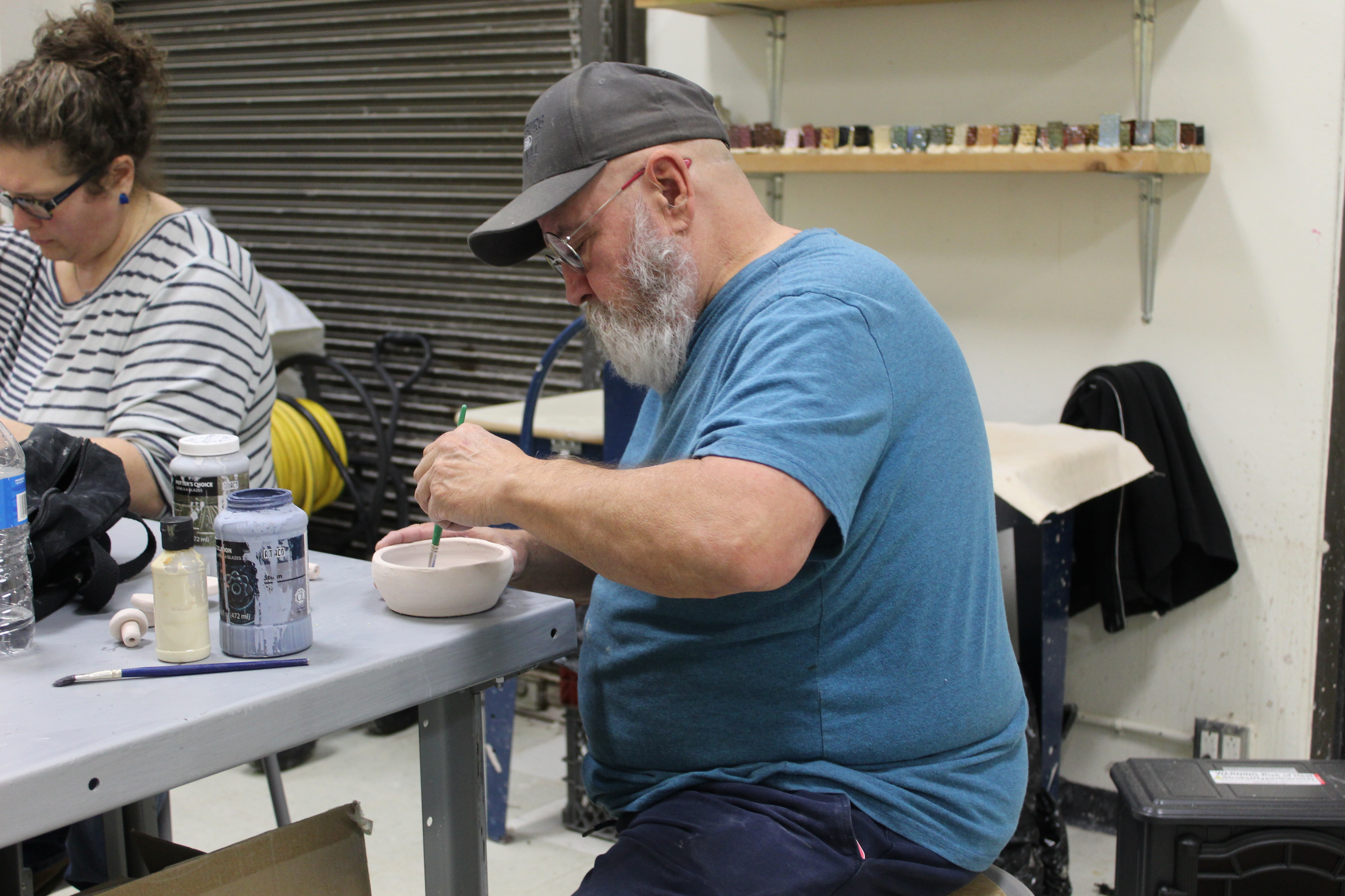 Man making ceramic bowl. 