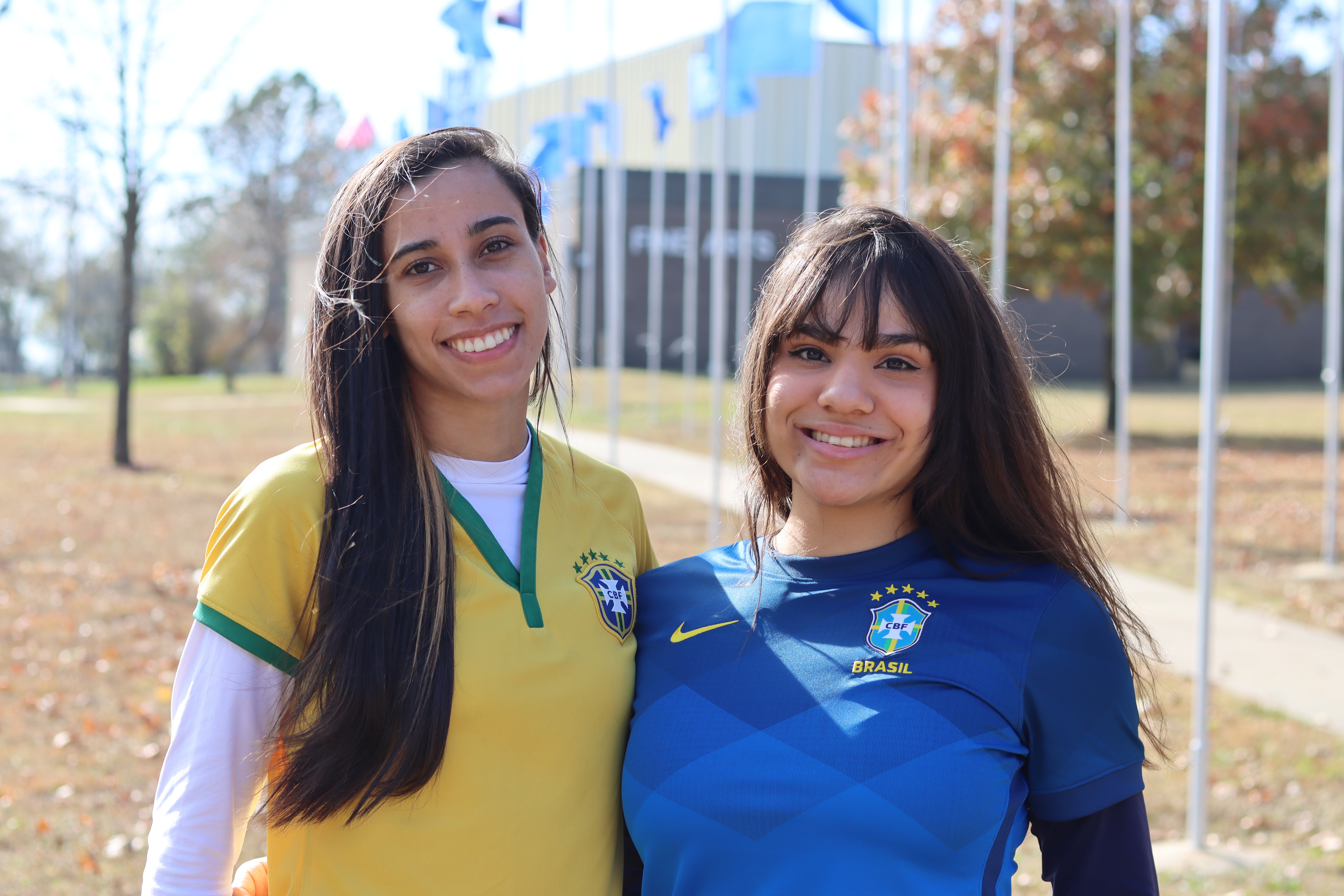 two female students smiling at International Flag Day at ICC
